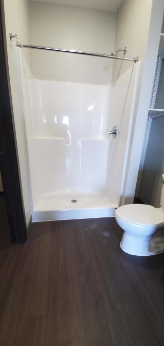Bathroom with walk in shower at Haven at Uptown