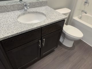 Bathroom vanity with one sink and cabinet storage