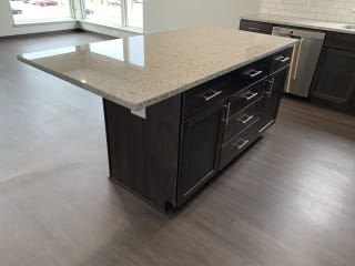 Kitchen island with room for seating and storage space inside