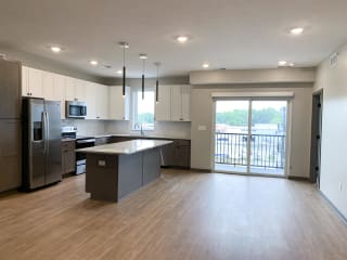 Living and dining area off of the kitchen at haven at uptown in lincoln nebraska