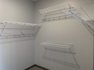walk in closet with hanging and storage space at haven at uptown