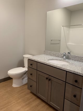 Bathroom Bathroom with light brown cabinetry and granite counter tops