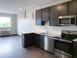Nest Studio Floor Plan in Mocha Finish at Haven at Uptown Kitchen looking into the combined living and sleeping area in a studio apartment