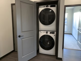 stacked washer and dryer in closet