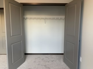 bedroom closet with hanging and shelving space