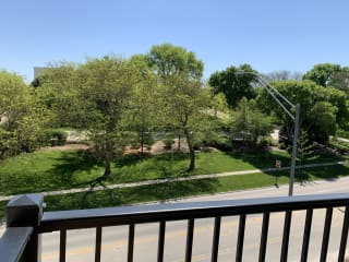 Bliss (1 bed, 1 bath) in Slate finish Scenic tree filled park view from outdoor balcony at Haven at Uptown in Lincoln.