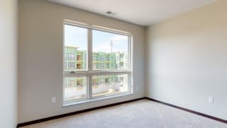 Natural light in bedroom provided by large windows at Haven at Uptown in Lincoln, NE