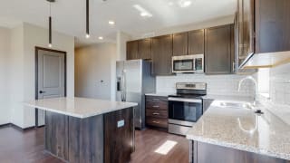 View of mocha style finishes in Shine floor plan kitchen at Haven at Uptown in Lincoln, NE