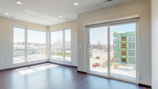 Living space with sliding doors to balcony at Haven at Uptown in Lincoln, NE