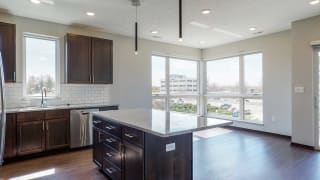 Kitchen and living space with abundant natural light at Haven at Uptown in Lincoln, NE