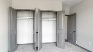 Double door closet in the second bedroom of the Shine floor plan at Haven at Uptown in Lincoln, NE