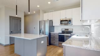 Shine (2 bed, 2 bath) in Slate finish Two tone slate finishes in the Shine floor plan kitchen at Haven at Uptown in Lincoln, NE