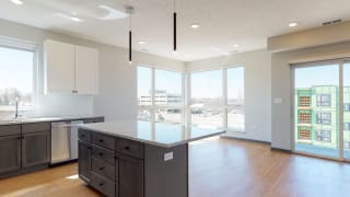 Shine (2 bed, 2 bath) in Slate finish Open concept kitchen and living-dining space in the Shine floor plan at Haven at Uptown in Lincoln, NE