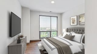 Spacious bedroom with floor-to-ceiling windows a 2 bedroom penthouse floor plan Midtown Crossing Apartments Omaha