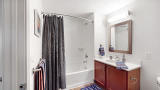 Spacious bathroom with tub and shower and large vanity in a 1 bedroom floor plan Midtown Crossing Apartments Omaha