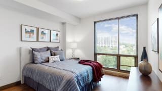 Spacious bedroom with floor-to-ceiling windows a 1 bedroom floor plan Midtown Crossing Apartments Omaha