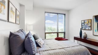 Bright and spacious bedroom with floor-to-ceiling windows a 1 bedroom floor plan Midtown Crossing Apartments Omaha