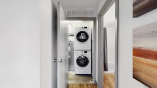 Full-size, front load, stacked washer and dryer is included in every floor plan at Midtown Crossing Apartments Omaha