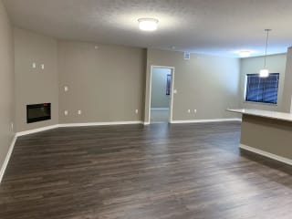 Large living and dining area with hardwood floors