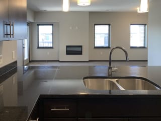 large granite counter with double sided sink in the kitchen of the grand canyon floorplan