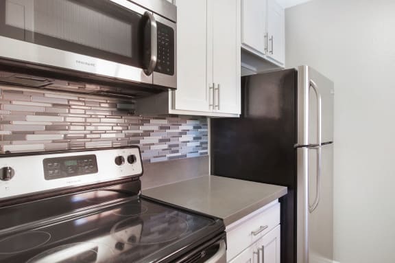 Modern Kitchen with Utilities at Pacific Trails Luxury Apartment Homes, Covina, CA