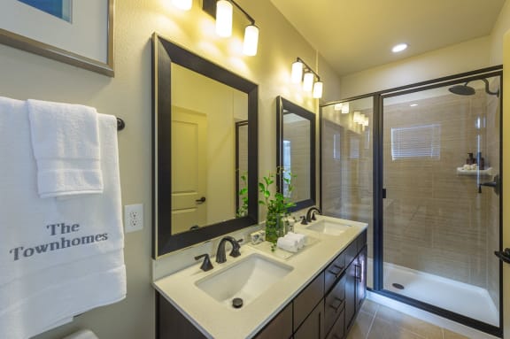 luxury bathroom with undermount sinks at the Townhomes at Woodmill Creek