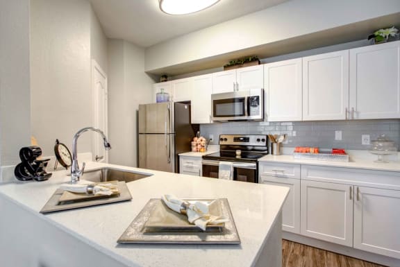 renovated kitchen with quartz countertops at tuscany bay apartments, tampa fl
