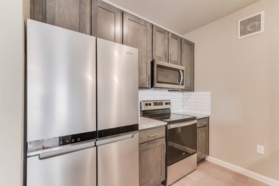 boterra at lago mar apartments kitchen with stainless steel refrigerator and oven