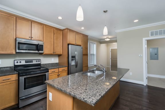 harrison park apartments kitchen with granite countertops