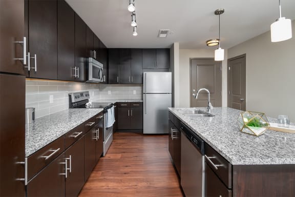 radius at the banks apartments kitchen with granite countertops