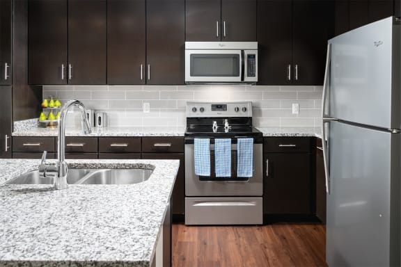 radius at the banks apartments kitchen with stainless steel appliances