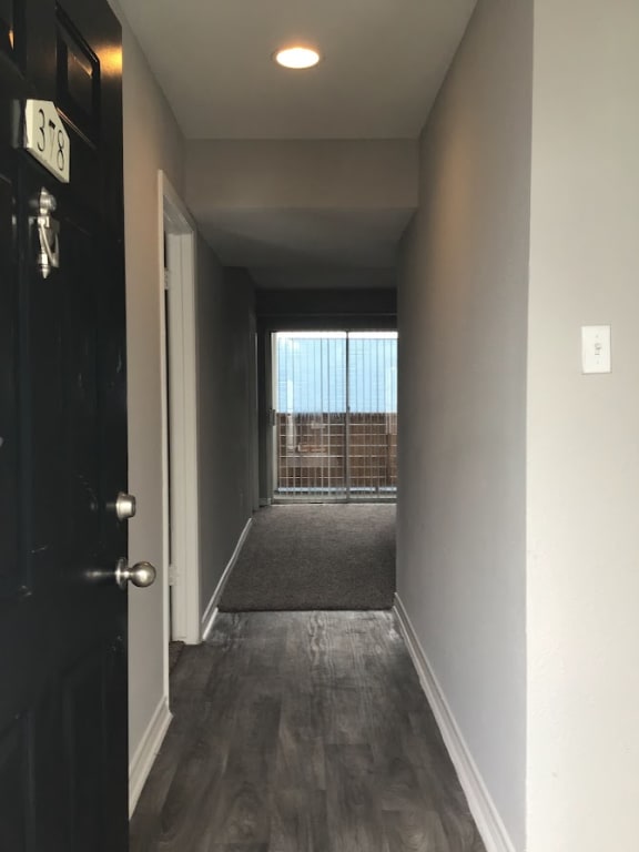 a hallway with a door and a window