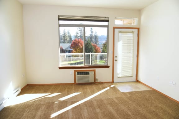Living Room With Expansive Window at The Lusitano Apartments, Spokane, Washington