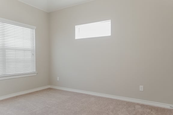 Beige Carpet In Bedroom at The Residences at Rayzor Ranch, Denton, Texas