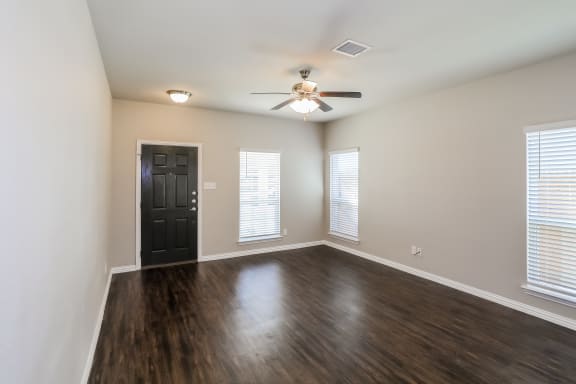 Living room space with wooden floor at Brooklyn Village Forney, Forney, 75126
