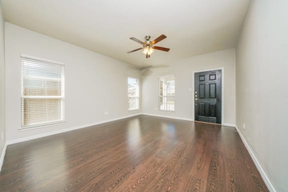 Living room wooden floors at Brooklyn Village Forney, Forney, TX, 75126