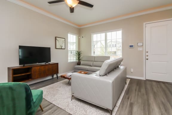 Living Room With TV at Pradera Oaks, Bonney, TX