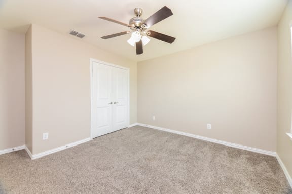 Bedroom with ceiling fan at Brooklyn Village Forney, Forney, Texas