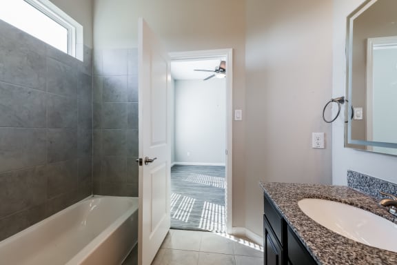 Bathroom with Granite Countertops and Double Vanity