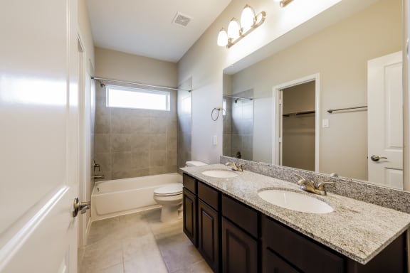 Bathroom with Granite Countertops and Double Vanity