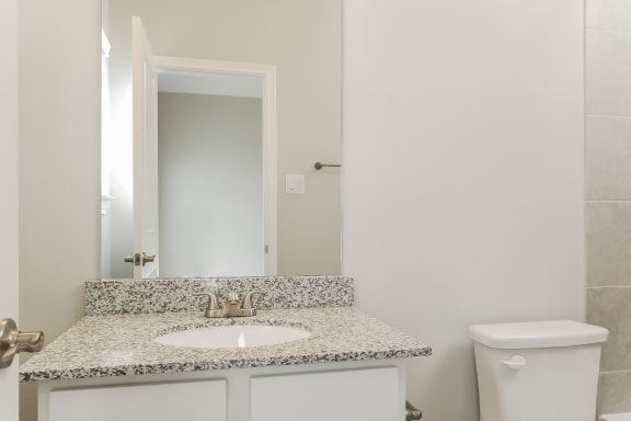 Renovated Bathrooms With Quartz Counters at The Residences at Rayzor Ranch, Texas