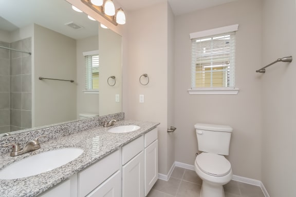 Primary bathroom with granite countertops  at Pradera Oaks, Texas, 77583