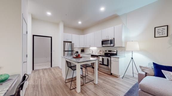 Fitted Kitchen With Island Dining at The Bessemer at Seward Commons, Minneapolis, 55404