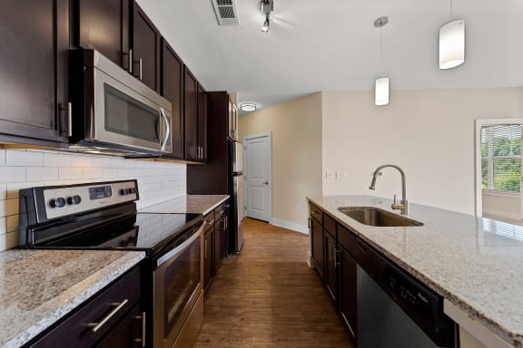 Fully Furnished Kitchen With Stainless Steel Appliances at Mezzo 1 Luxury Apartments, Charlotte, North Carolina