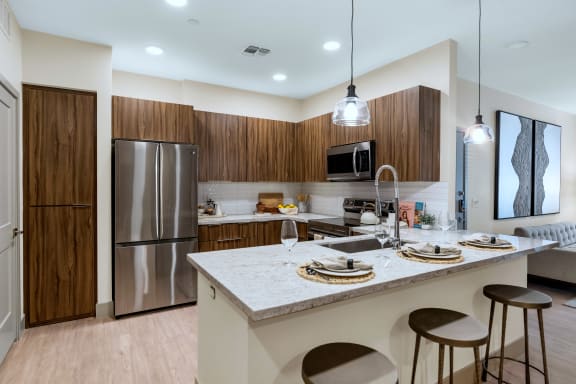 Fitted Kitchen With Island Dining at Zaterra Luxury Apartments, Arizona