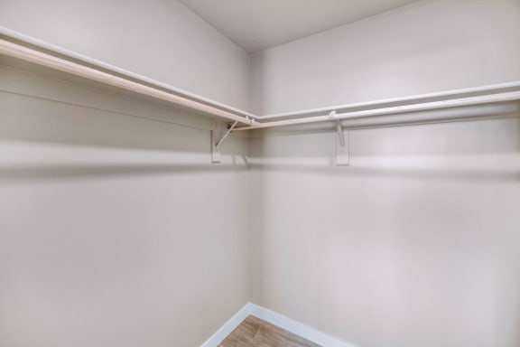 Walk In Closets with Built In Shelving &amp; Storage at The Premiere at Eastmark Apartments, Arizona