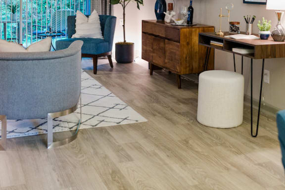 living room with hardwood-inspired flooring at The Jameson Apartments, Alabama