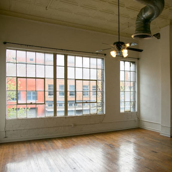 loft with large windows and polished wood floors at Goodall-Brown Lofts, Alabama