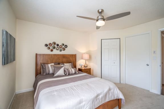 Ceiling fan in model apartment home bedroom