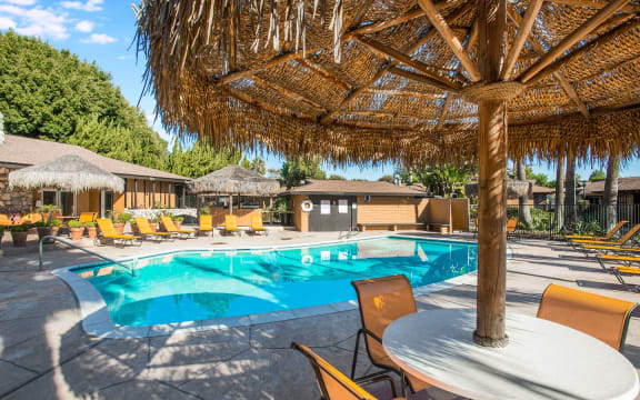 Apartments in Carlsbad CA - The Village Apartments Resort-Style Sparkling Pool with Lounge Chairs, Attached Clubhouse, and Many More Amazing Community Amenities